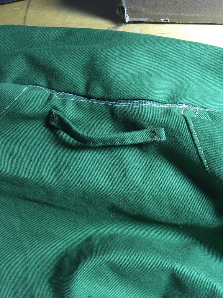 a loop added to the top back of the jumpsuit