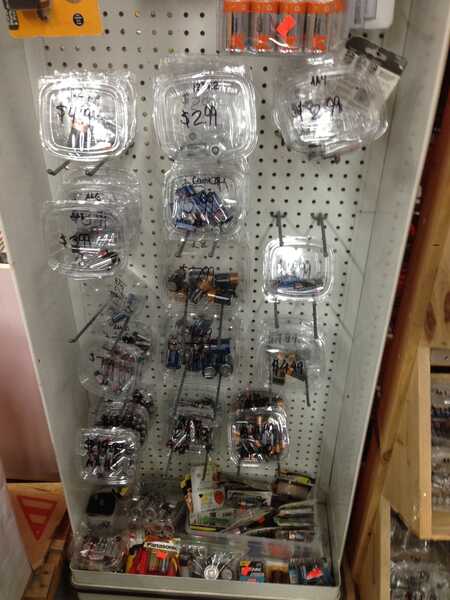 batteries in clear plastic tubs on a rack
